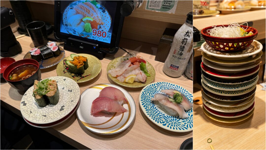 A full table at Daikisuisan Sushi in Dotonbori with sushi plates, miso soup, and stacked empty dishes after the meal. 도톤보리 대기수산 초밥에서 식사 중 주문한 초밥과 장국, 식사 후 쌓아올린 접시들